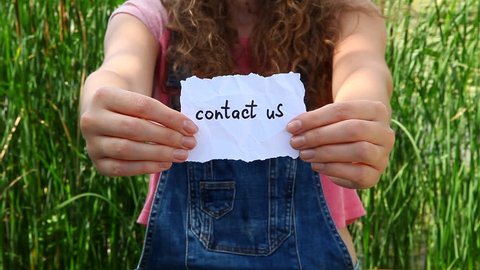 Contact us - woman show words, business concept