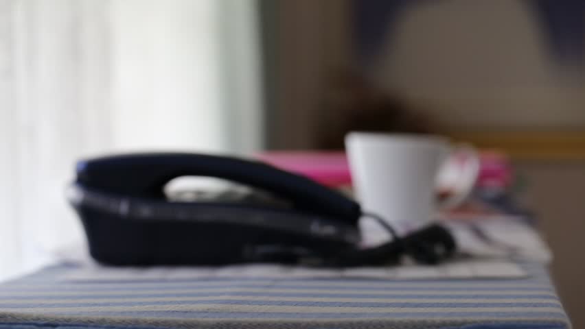 People putting paper work on the desk closeup on window and coffee cup blur background