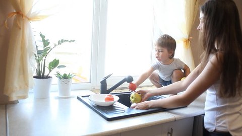 Little Boy Son Helps Mom Kitchen Stock Footage Video (100% Royalty-free