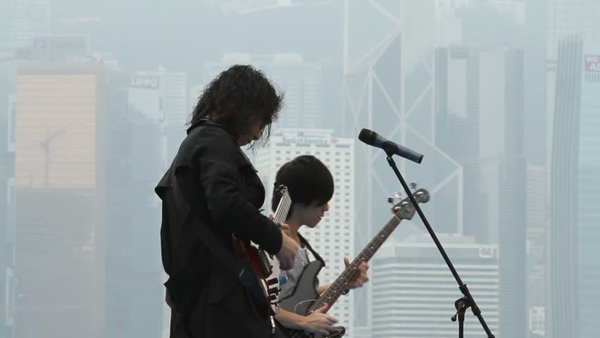 HONG KONG - NOVEMBER 14: Young rock band performing at free open air music