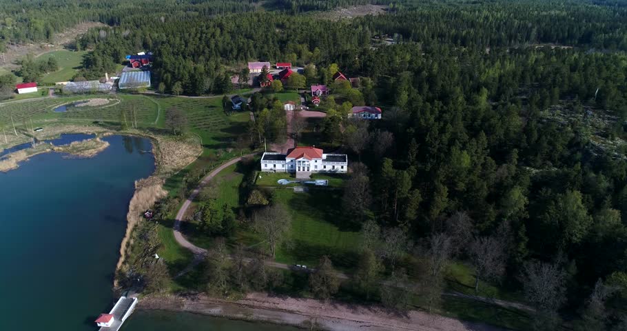 KEMIO, VARSINAIS-SUOMI, FINLAND - MAY 25: Cinema 4k aerial landing view infront of soderlangvik mansion, on kemionsaari, in Varsinais-suomi, Finland
