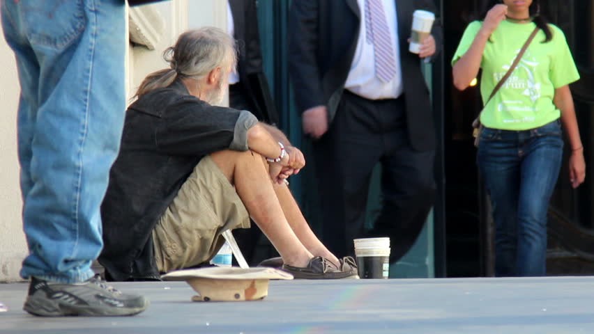 LAS VEGAS, NEVADA - October, 2012: A homeless man on a pedestrian overpass in