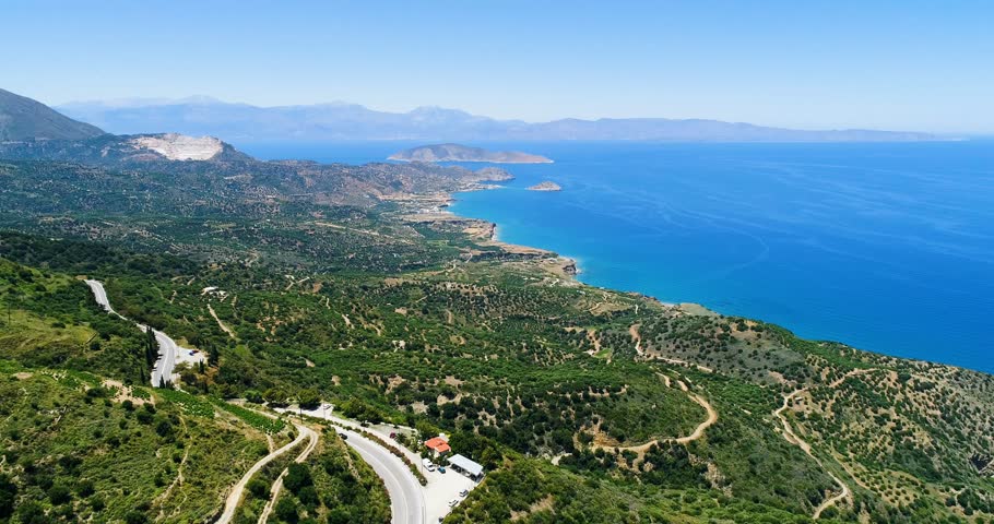 Greece. Crete. View of the plantation of olive trees and the Aegean Sea from a bird's eye view close-up.
