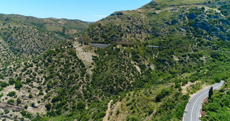 Europe. Greece. Crete. View of the olive tree plantations and the road from a bird's eye view.