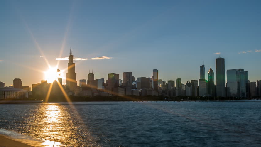 Beautiful Sunset in Chicago through buildings 4K 1080P - Sun setting in Chicago on Lake michigan time lapse of downtown