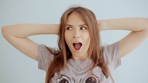 Portrait of young surprised and shocked teen girl