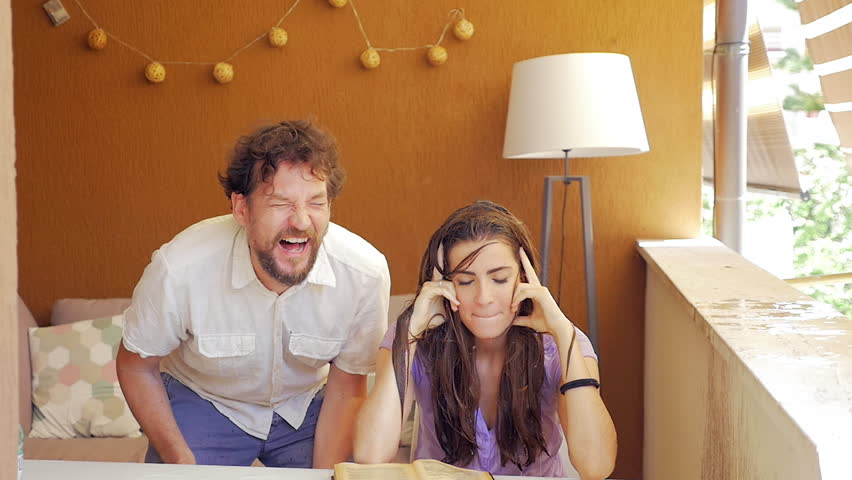 Reaction of woman after being splashed bucket of cold water on head slow motion wide