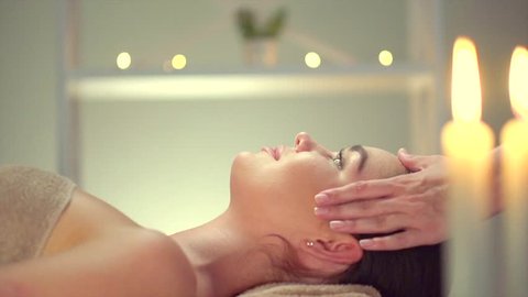 Spa facial Massage. Face Massage in beauty spa salon. Beauty Treatments. Body care, skin care, wellness, wellbeing, beauty treatment concept. Slow motion 240 fps 4K UHD video 3840x2160