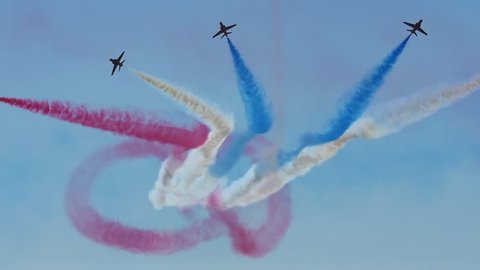 WESTON, ENGLAND - June 17: Slow Motion Red Arrows RAF (Royal Air Force) 'Figure of 8' Formation at Airshow Display on June 17 2017 in Weston Super Mare, England.