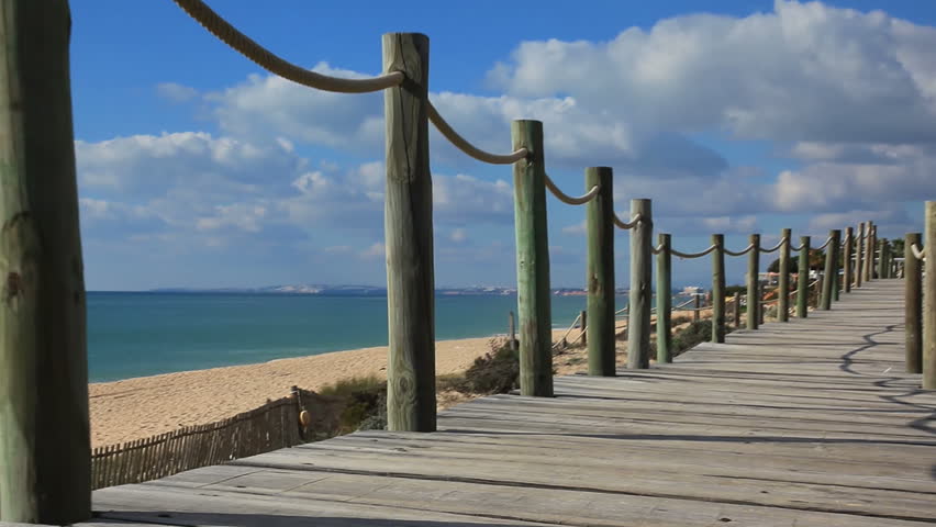 Wooden footpath boardwalk  on beach in Portugal
