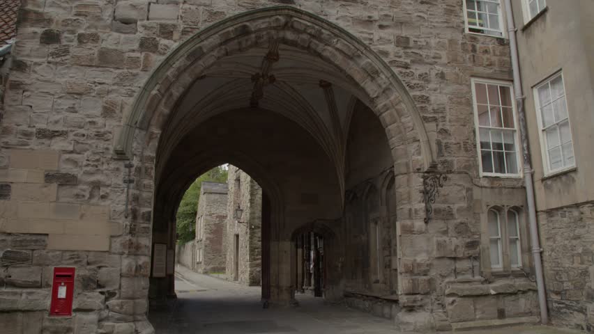 Arched Gateway into Durham Cathedral with Post box. 4K