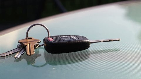 Man picks up car keys from restaurant table in summer