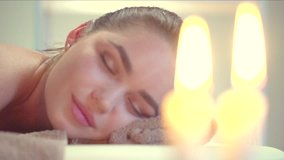 Spa Woman. Female relaxing in cosmetology spa center. Body care, skin care, wellness, wellbeing, beauty treatment concept. Massage. Slow motion 240 fps. 4K UHD video 3840x2160 