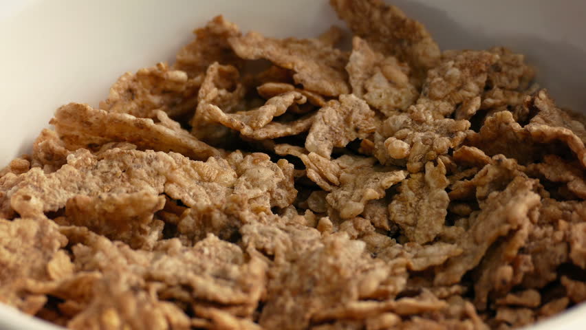 Milk Pours On Cereal Closeup