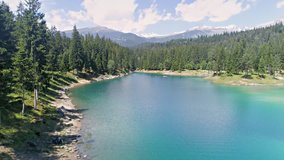 Aerial footage in 4k quality of a beautiful lake in the Swiss mountains called Caumasee.