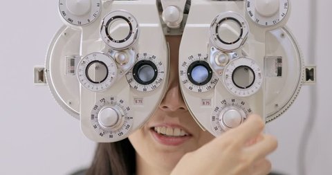 Asian woman having eye test. eye test machine