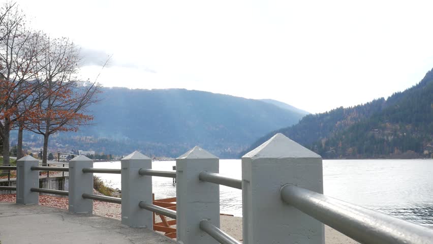 Moving Along Nelson Water Front On Kootenay Lake With Mountains In Fall