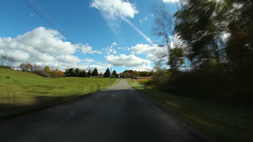 A time lapse shot of a driver's perspective of the back roads of western