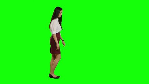 Girl goes to work and waves her hand. Green screen. Side view