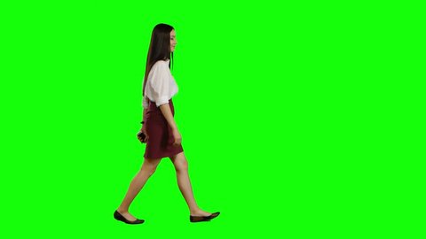 Girl is going to an important meeting, talking on the phone, she is angry. Green screen