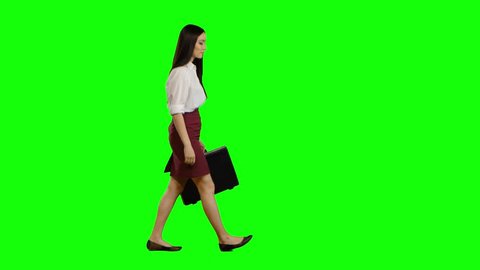 Girl hurries to important negotiations, in her hand a diplomat with documents. Green screen