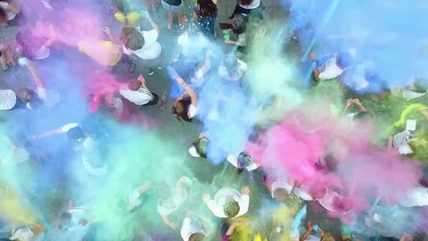 Vinnytsia, Ukraine - June 13, 2017: Birthday of Vinnitsa Central City Recreation Park. People throwing colorful paint and powder during holi festival celebrations.