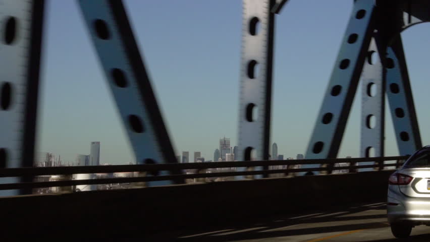 View of the Philadelphia Skyline while driving over the Betsy Ross Bridge, in slow motion