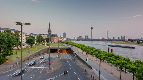 Düsseldorf rhine shore with traffic at summer, after the sunset. Timelapse view.