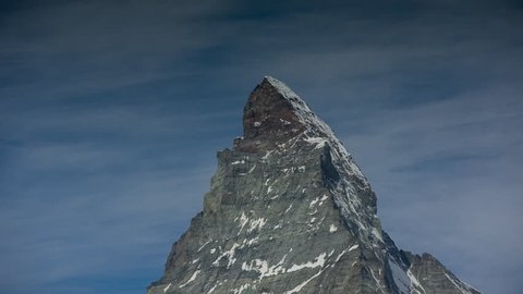 zooming video of the amazing matterhorn and surrounding mountains in the Swiss Alps with fantastic cloud formations