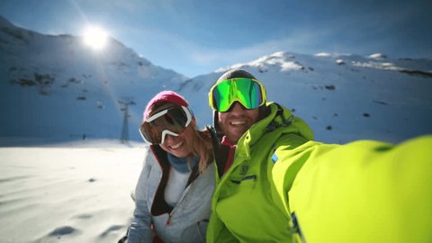 Couple taking selfie on ski slope
Young couple takes selfie on ski slopes, Swiss Alps