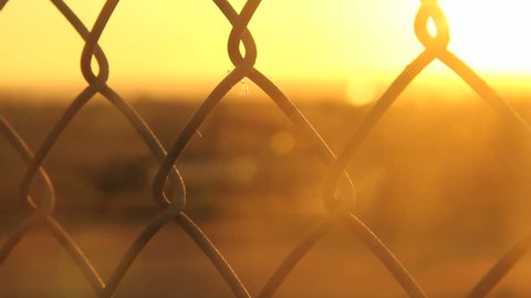 Chain Fence Against Golden Sun