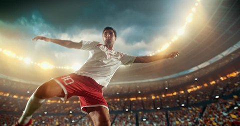 4k footage of a soccer player in dramatic play during a soccer game on a professional outdoor soccer stadium. Player wears unbranded uniform. Stadium and crowd are made in 3D.