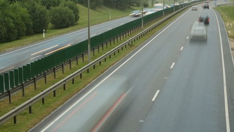 Time lapse of free flowing road traffic on the motorway. Day.
