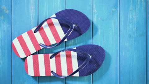 Flip flops with red white and blue pattern with July 4th theme.