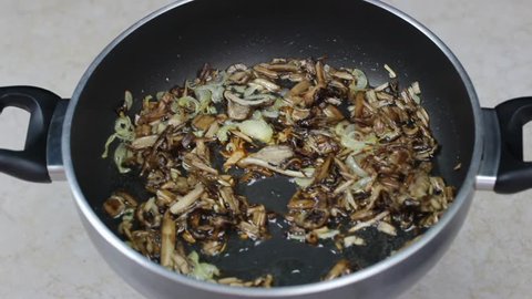 cooking mushrooms in frying pan