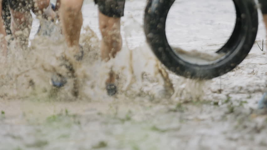 Soldiers running thought mud