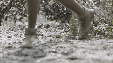 Soldiers running thought mud