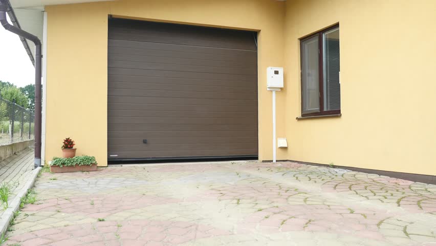 Automatic black metal gates move.