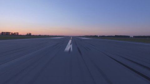 Airplane accelerates over the runway - POV 4K