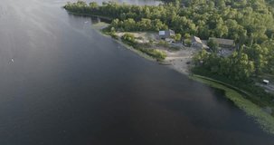 Ukraine. Kiev. July 18, 2017. Truhanov Island. Aerial photography. 4K video. River Dnieper. Forest. Trees. Summer. Sunny weather. The sun. Kayaks. People. Water. Canoe. Beach.