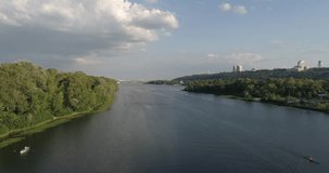 Ukraine. Kiev. July 18, 2017. Truhanov Island. Aerial photography. 4K video. River Dnieper. Forest. Trees. Summer. Sunny weather. The sun. Kayaks. Water. Canoe. Panorama. Sky.