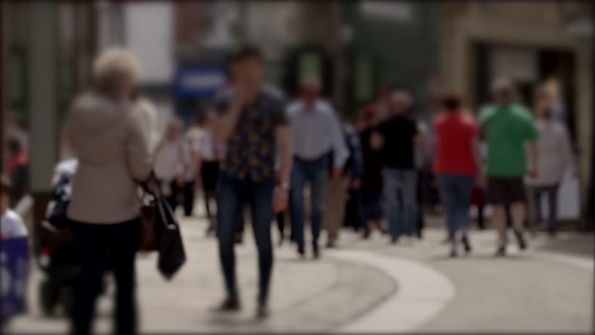 Blurred 4K video of crowds on busy high street. Summer shoppers etc. Cobbled street.
Durham UK.  Royalty-Free Stock Footage #28931854