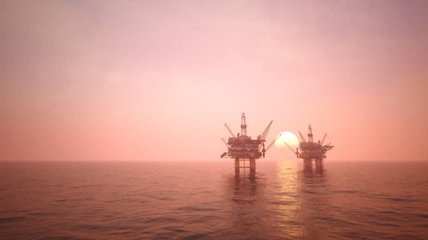 02839 Two offshore platforms or oil rigs at sunset pink sky