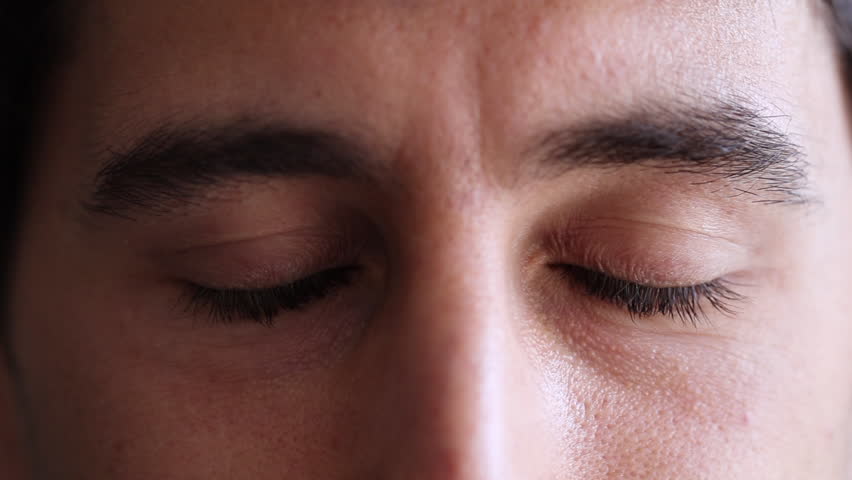 Man Meditating Eyes Closed Opens Eyes