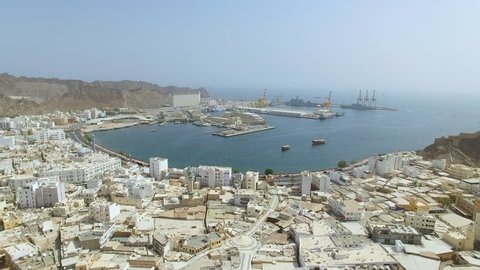Aerial view of cityscape of Muscat, harbor and capital city of Oman, sultanate on Arabian Peninsula from above