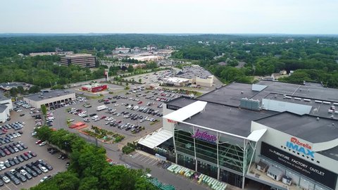 READING, MA, USA - JULY 1, 2017: Aerial video of a commercial shopping plaza and parking lot 4k