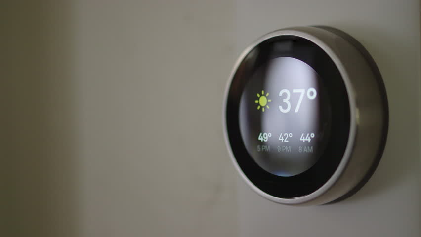 Man Adjusting Smart Thermostat Gadget At Home | Shutterstock HD Video #28941808