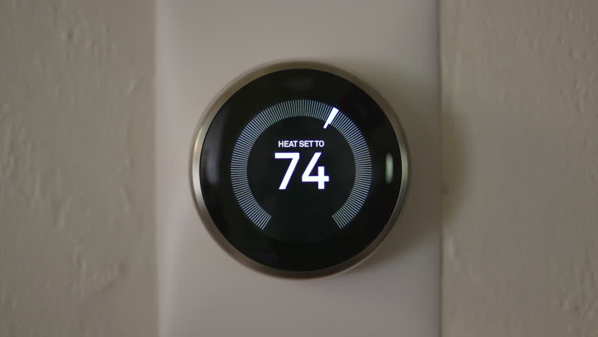 Man Increasing Temperature of Smart Thermostat Gadget At Home | Shutterstock HD Video #28941820