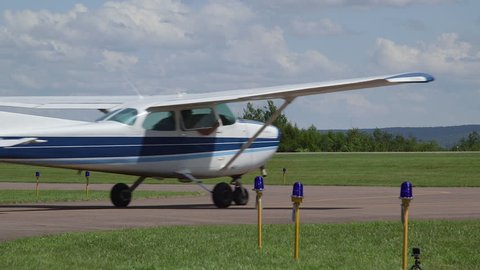 Blue Cessna 172 Airplane Taxiing on Runway