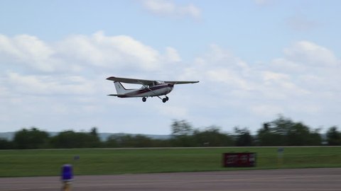 Red Cessna 172 Skyhawk II Airplane Takeoff on Runway